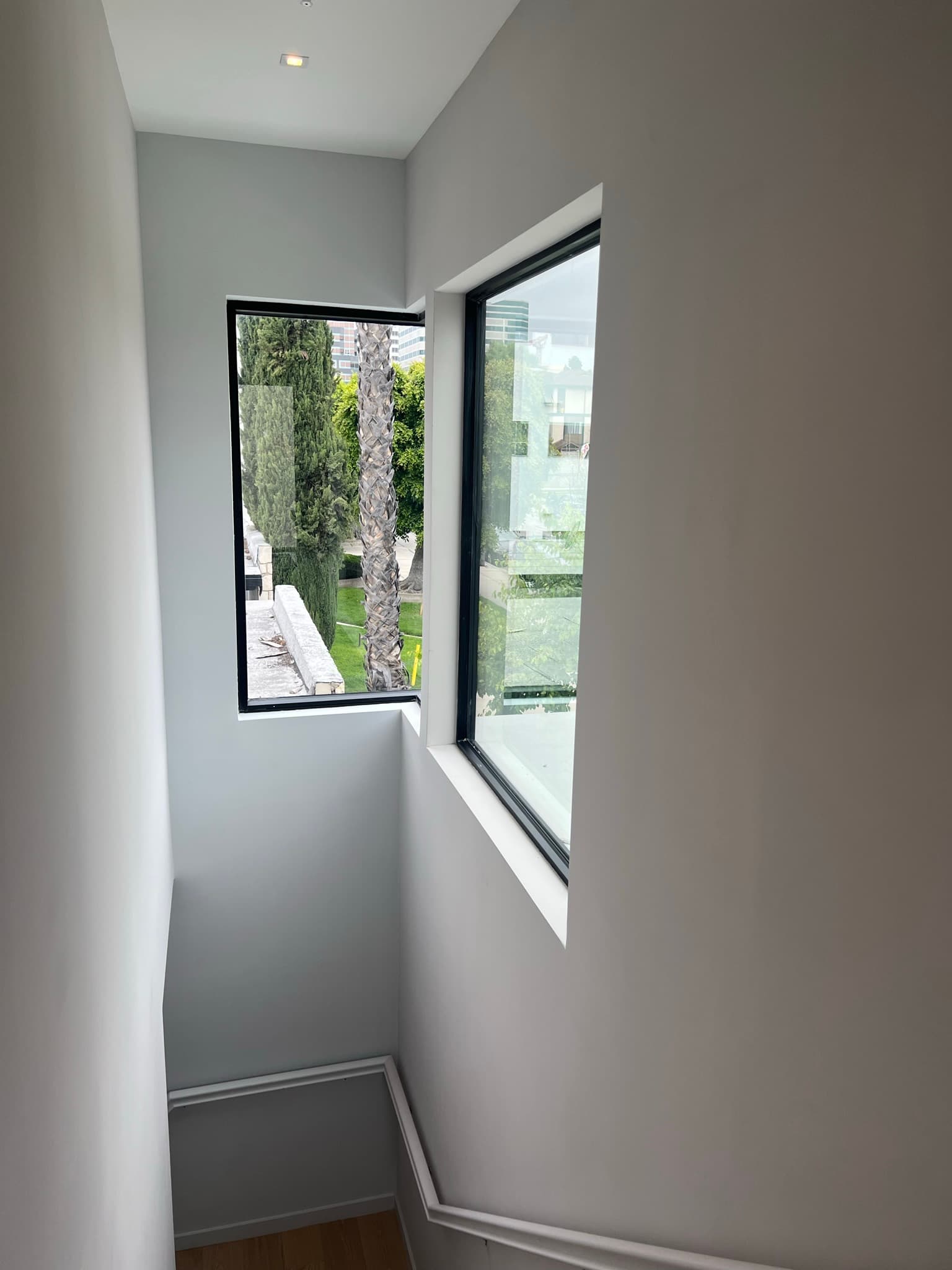Doran Townhomes stairwell window with landscaped view