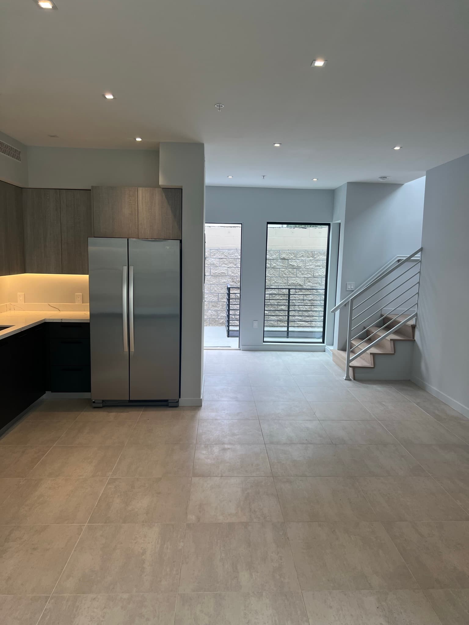 Doran Townhomes open-concept kitchen and living area with staircase