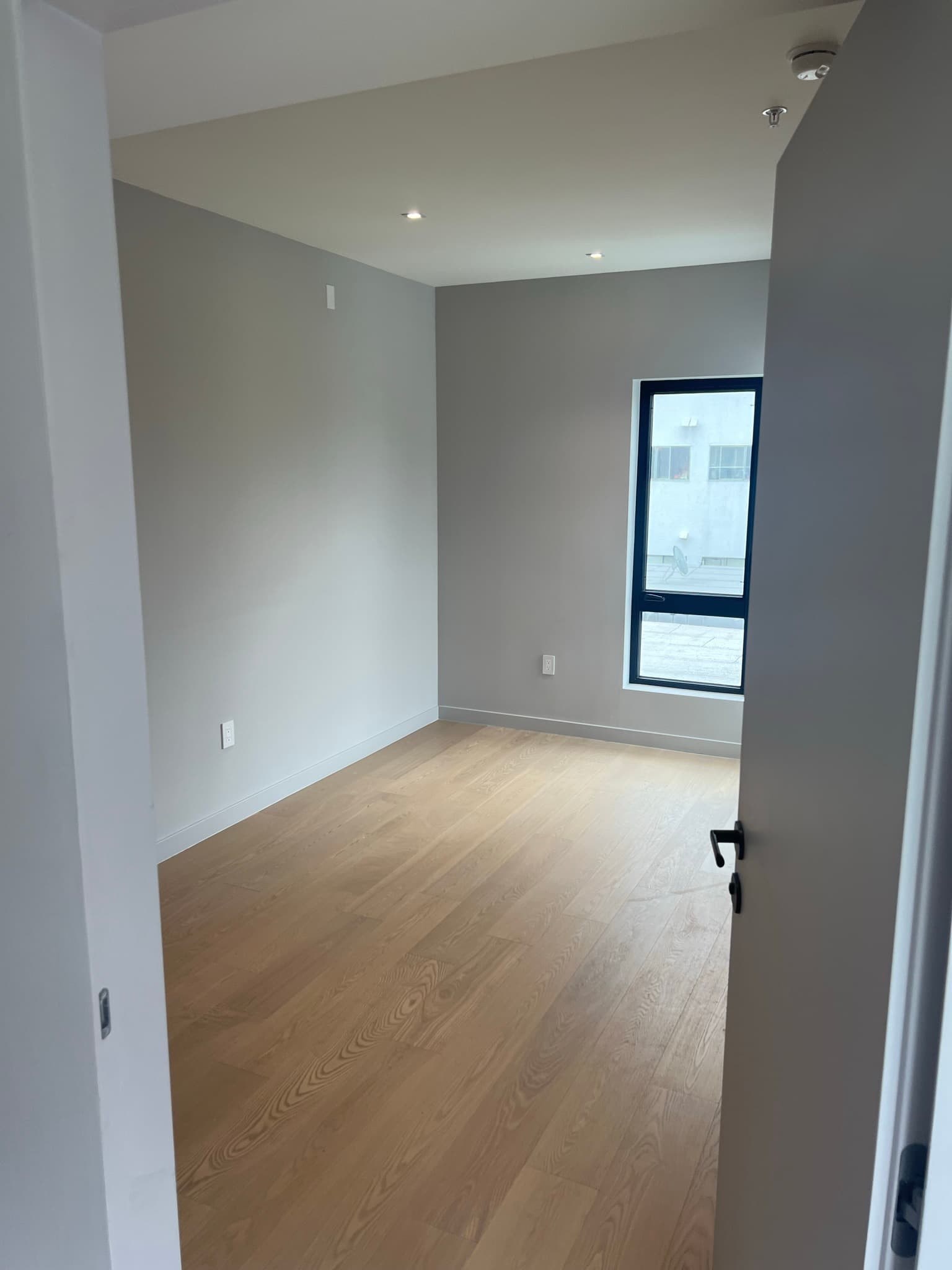 Doran Townhomes bedroom with wide-plank hardwood flooring