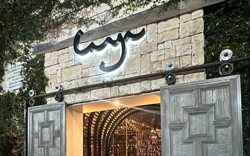 Laya Restaurant entrance with illuminated signage at night