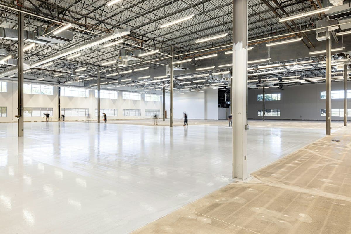 Empty modern commercial space with polished concrete floors ready for tenant improvement build-out in Los Angeles